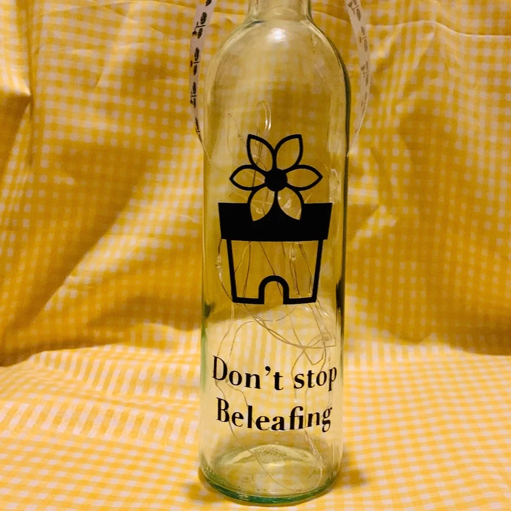 ‘Don’t Stop Beleafing’ logo wine bottle lantern